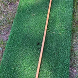 Full length 48 inch hickory golf alignment stick on a mat
