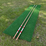 Pair of handmade hickory golf alignment sticks with red, white and black painted bands