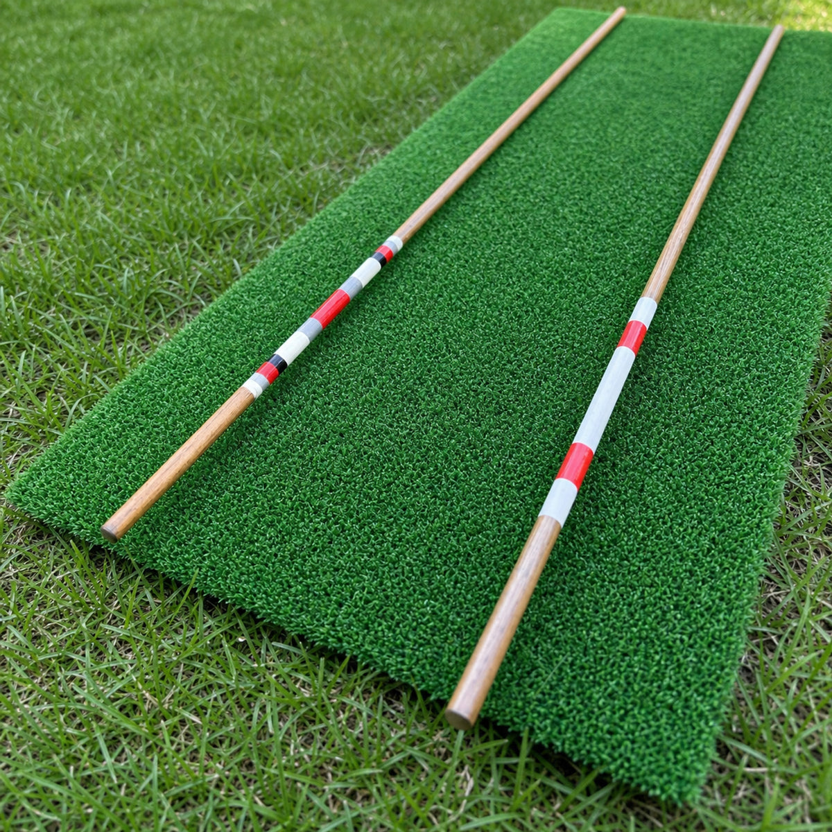 Close view of handmade hickory alignment sticks and their painted red, white and black bands