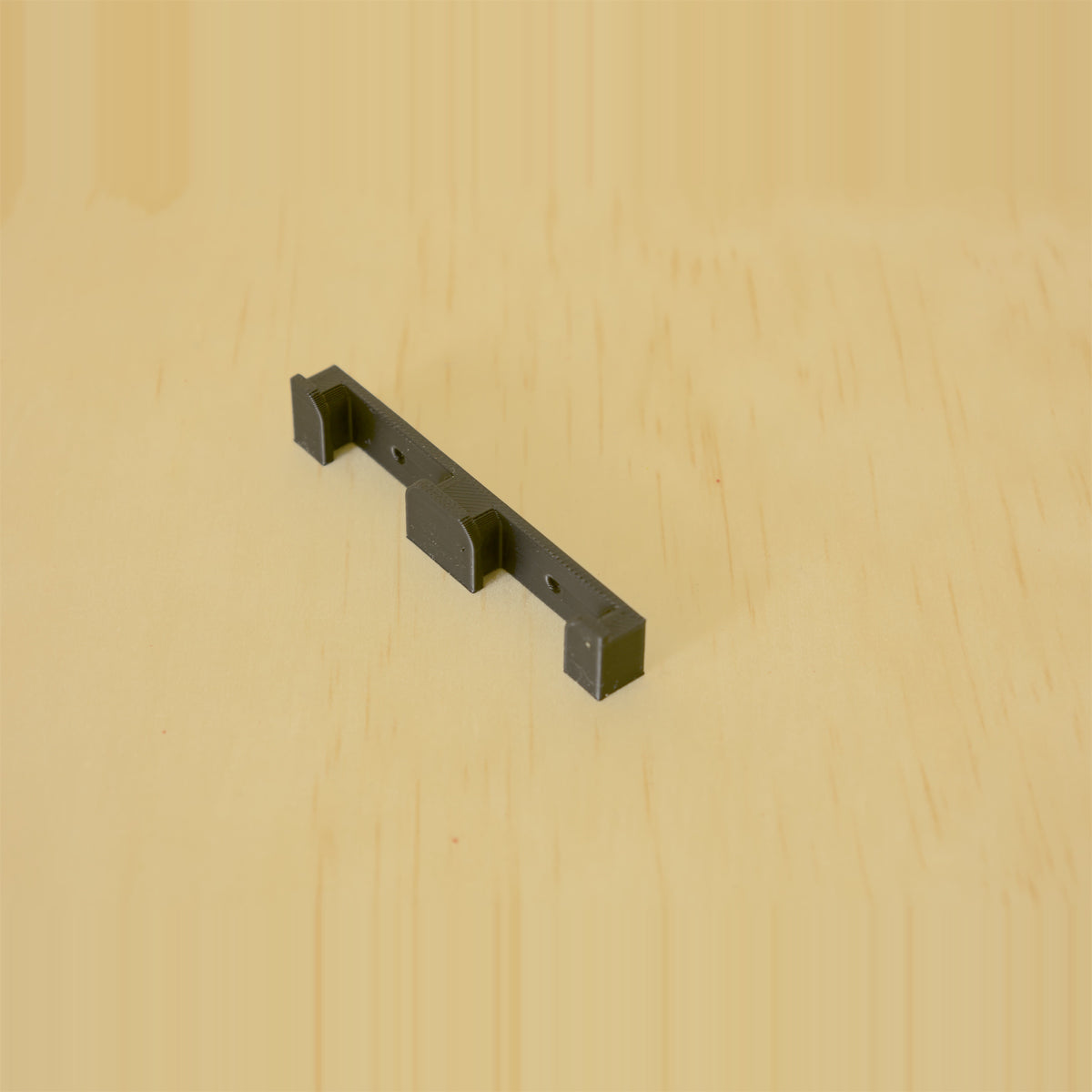 Black two-band Apple Watch band wall holder with two storage positions