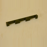 Detailed view of a black three-band Apple Watch band wall holder