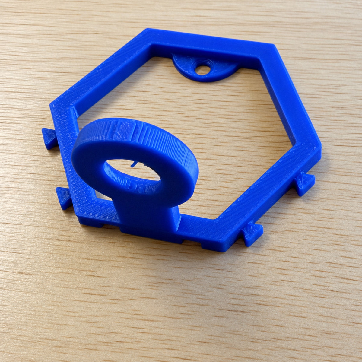 Blue modular golf ball display mount shown at an angle