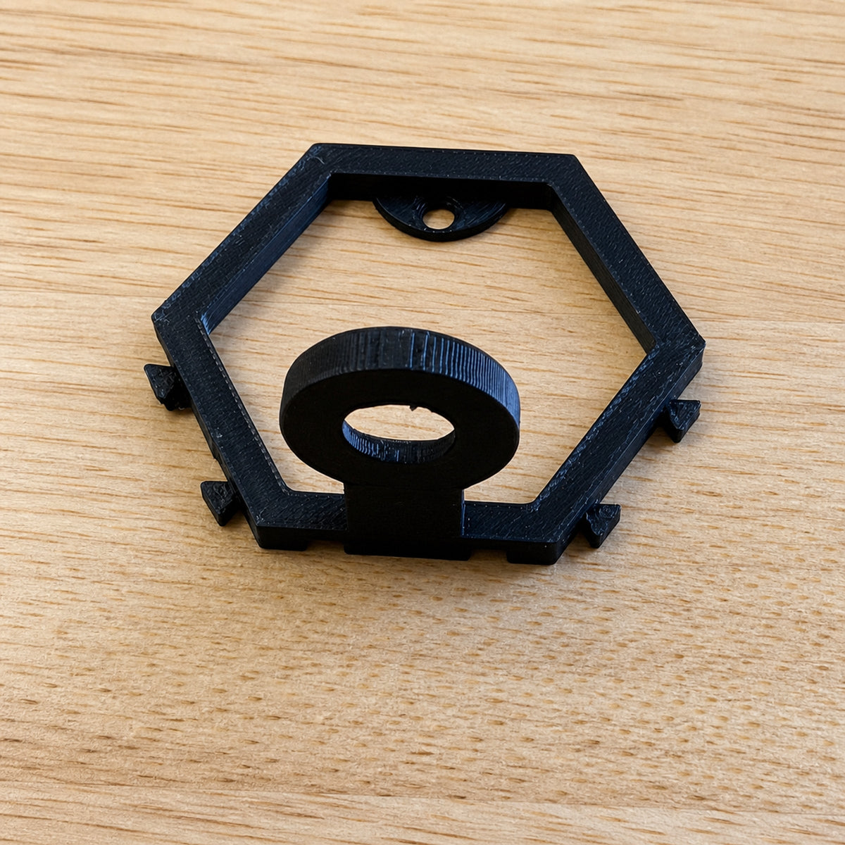 Black modular golf ball display mount shown at an angle