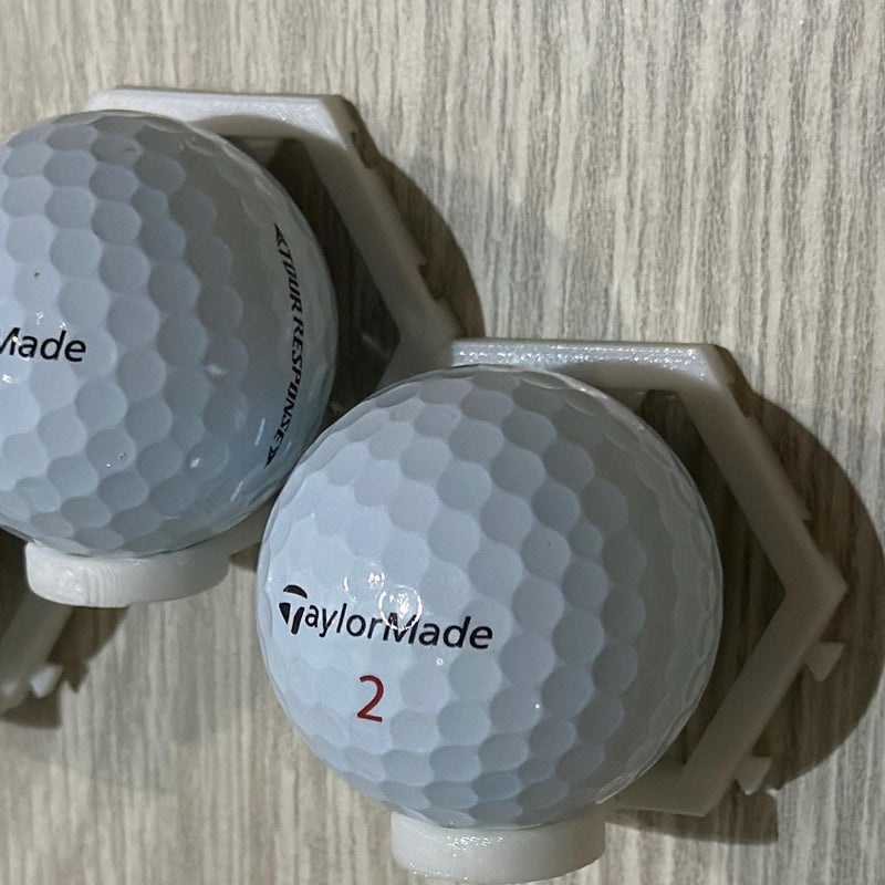 Golf balls held in the modular wall mount, close angle