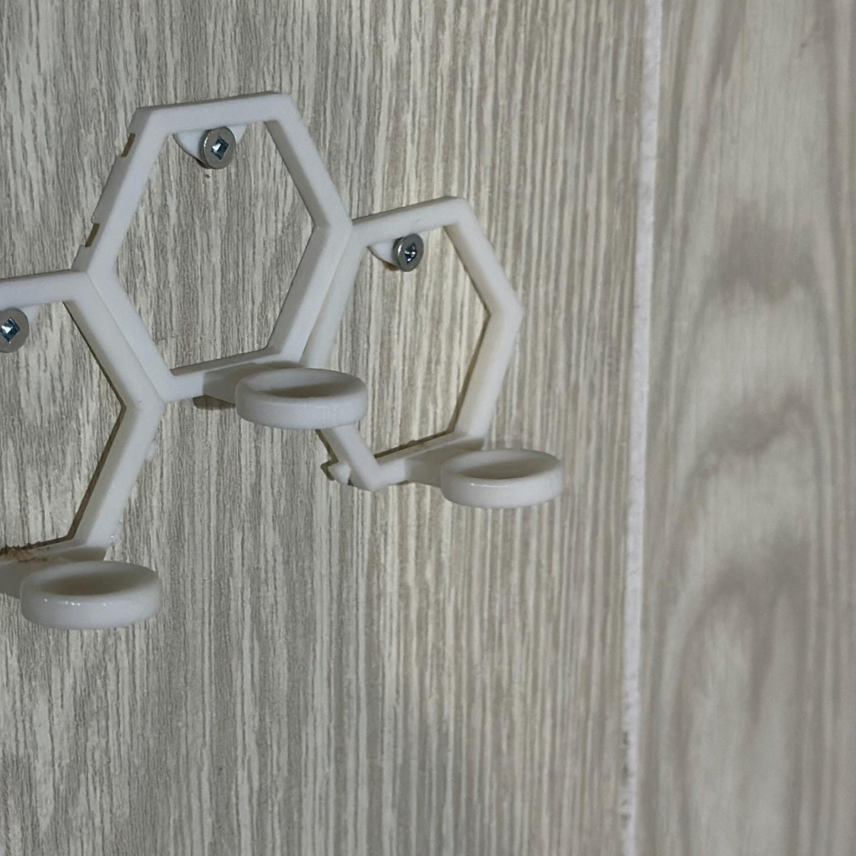 Empty modular golf ball wall mount, angled view