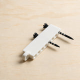 White golf tee holder loaded with tees, angled product view