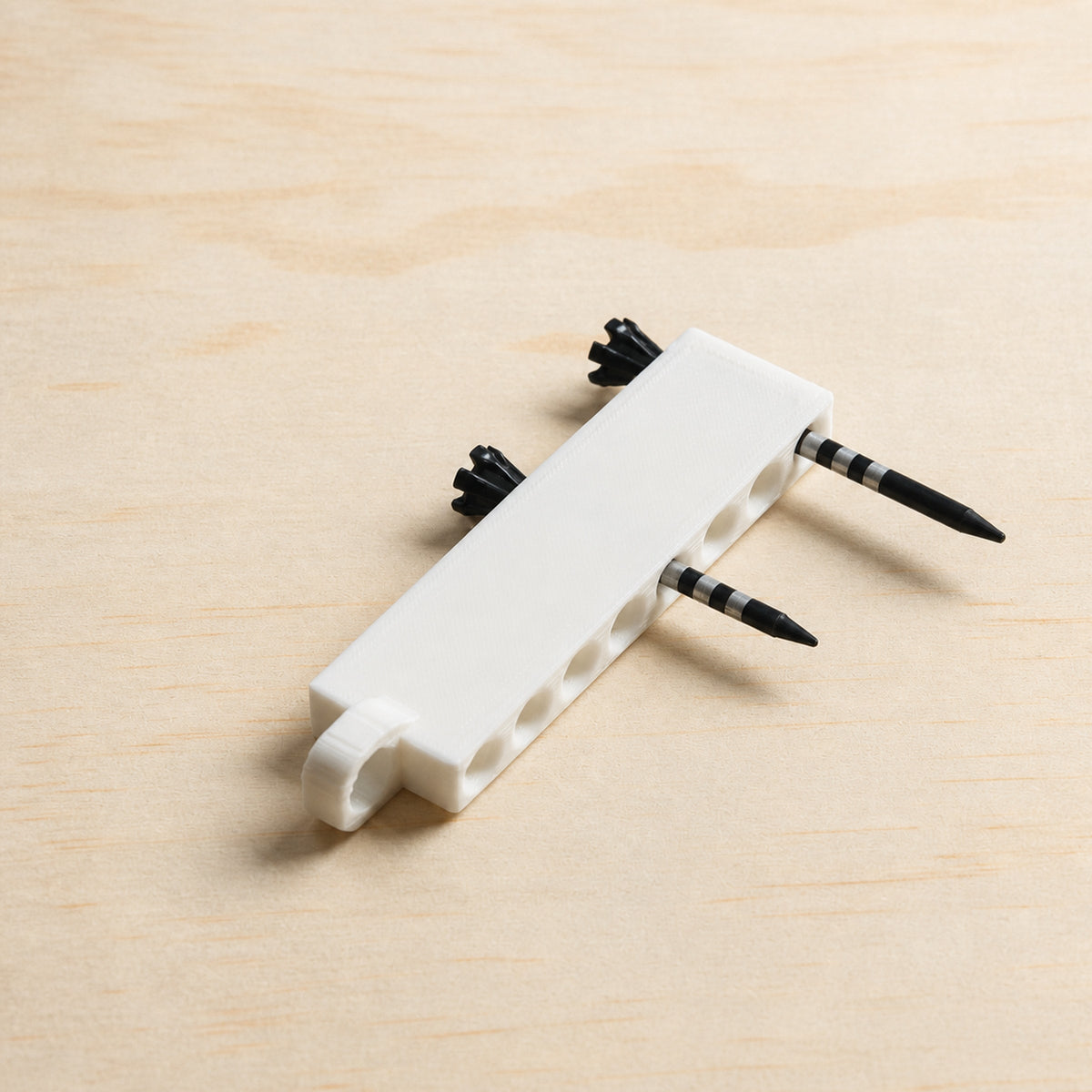 White golf tee holder loaded with tees, angled product view