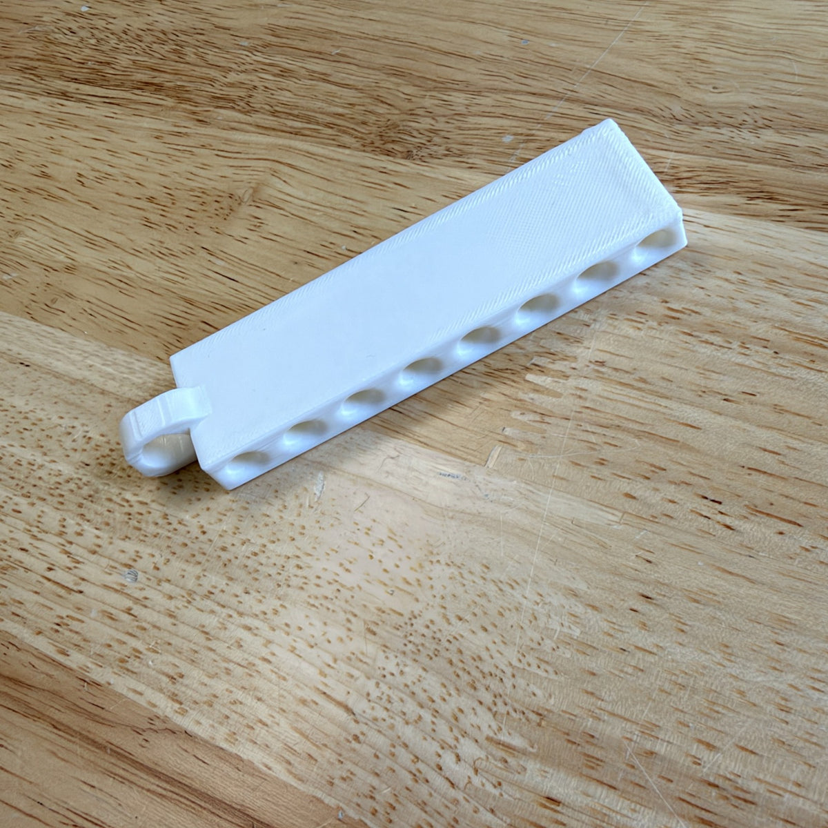 Golf tee holder, angled view