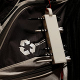 White golf tee holder in use on a golf bag